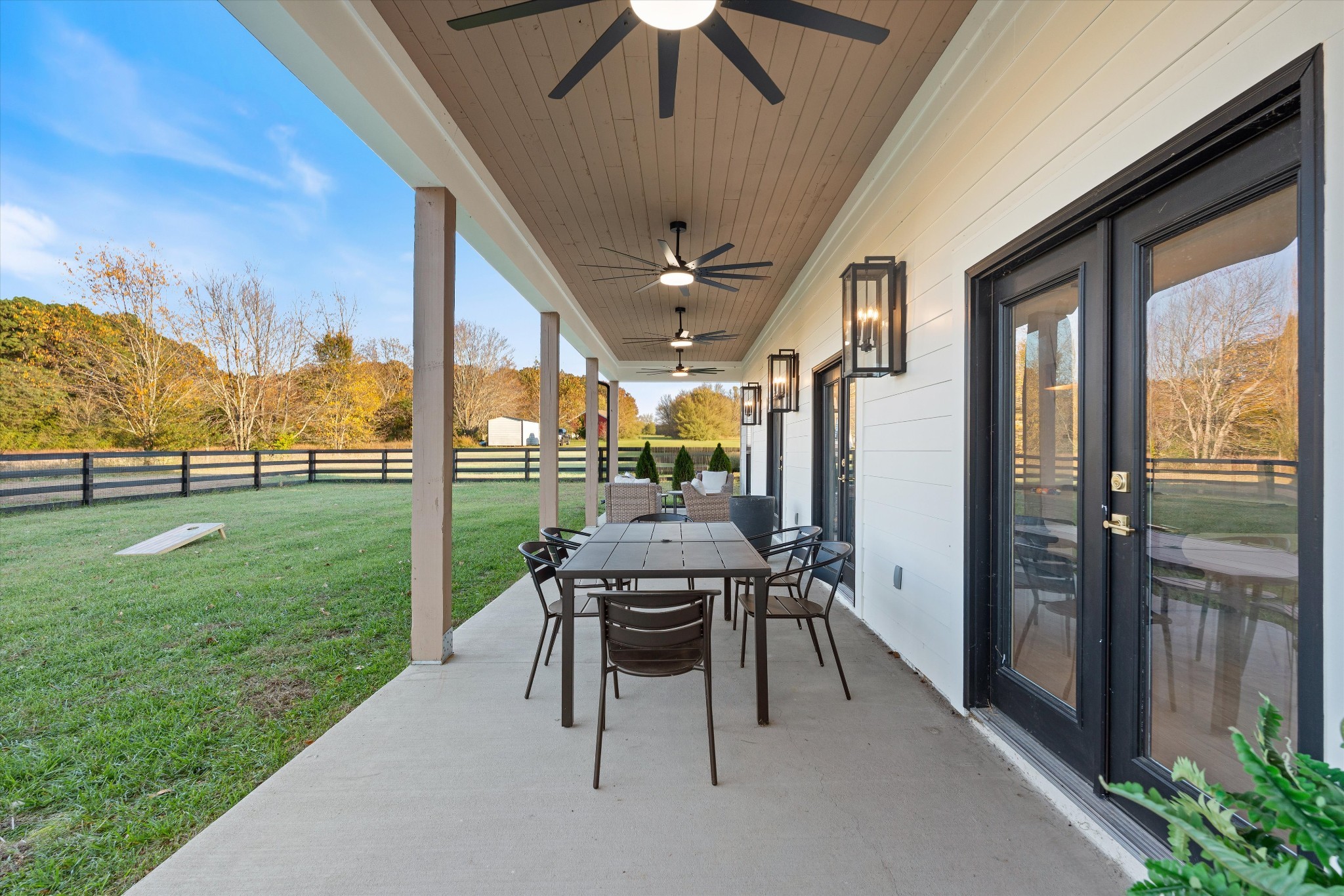 7314 Dug Hill Road Bon Aqua, TN 37025 - Photo 41 of 79 a view of a porch with chairs and backyard