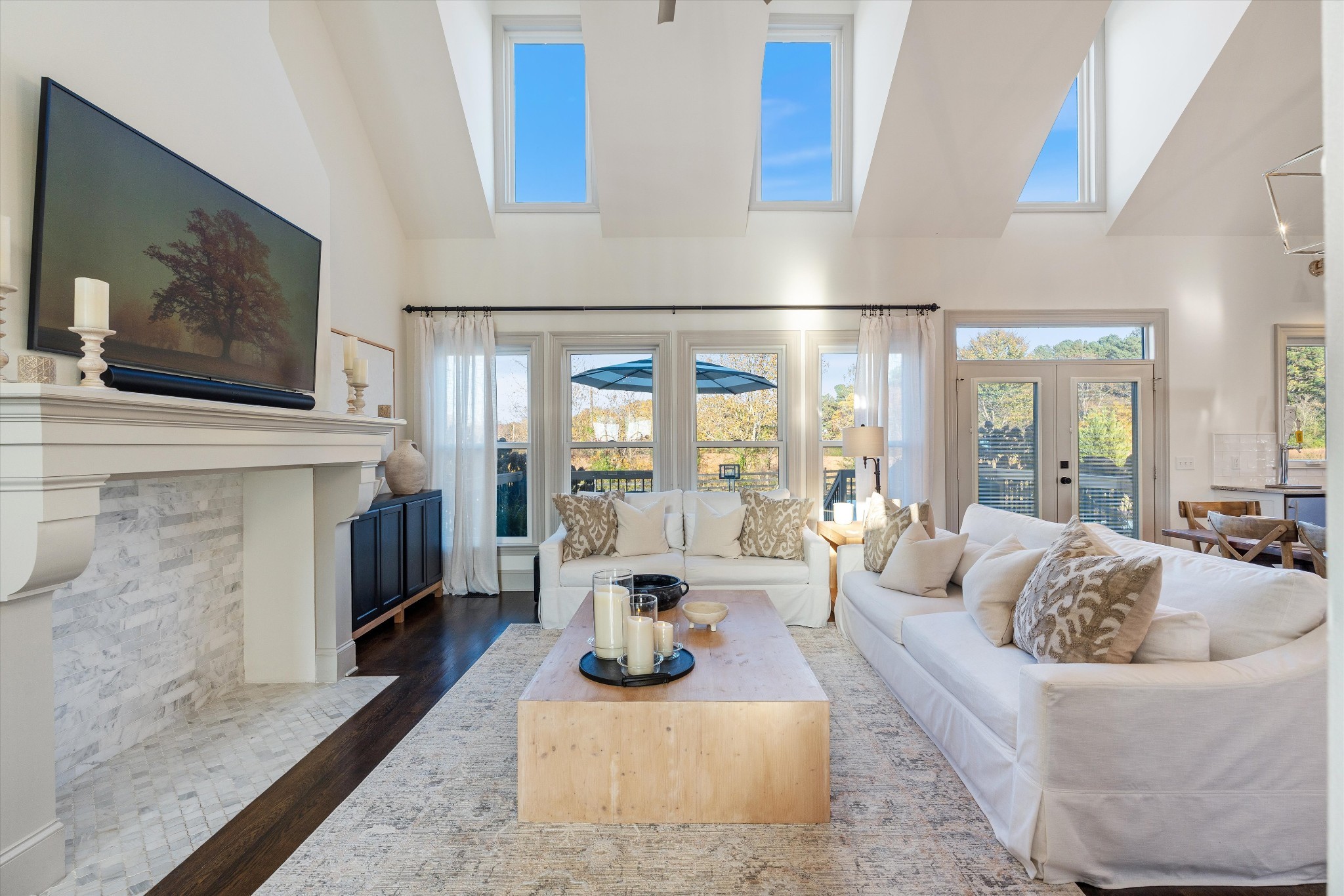 7314 Dug Hill Road Bon Aqua, TN 37025 - Photo 6 of 79 a living room with furniture a fireplace and a flat screen tv