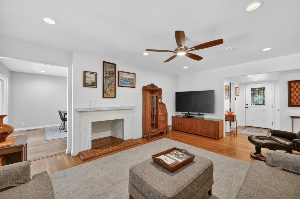 4831 Jan Drive Carmichael, CA 95608 - Photo 22 of 69 a living room with furniture a fireplace and a flat screen tv