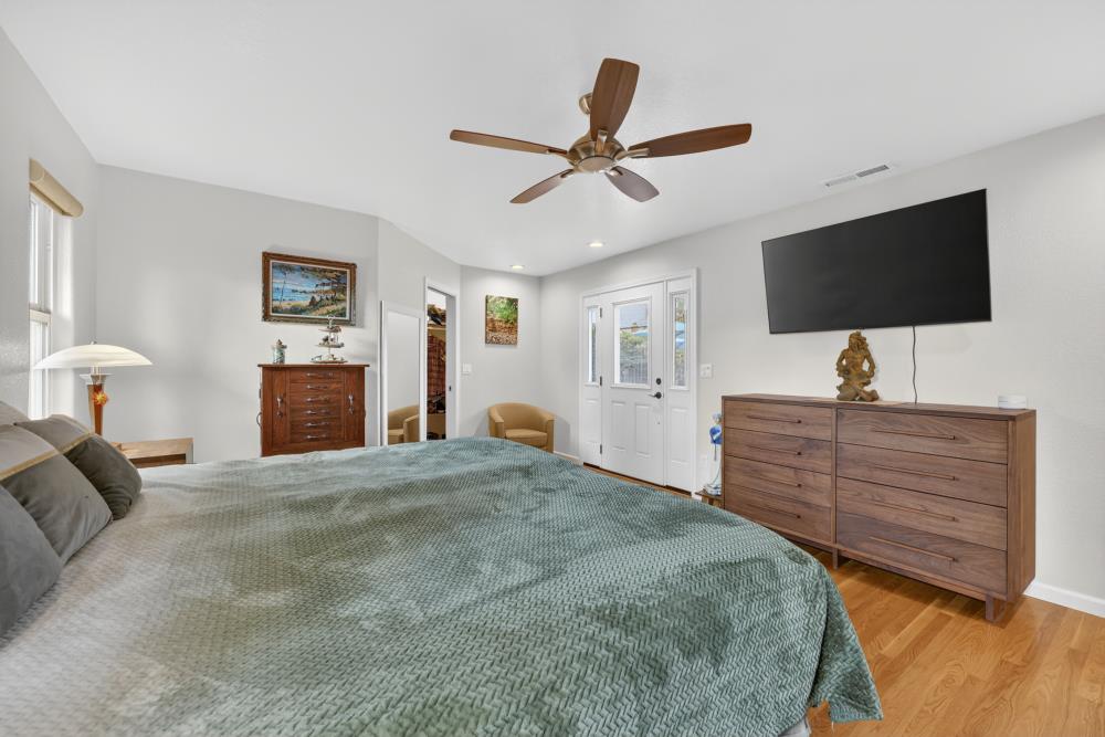 4831 Jan Drive Carmichael, CA 95608 - Photo 26 of 69 a bedroom with a bed and a flat screen tv