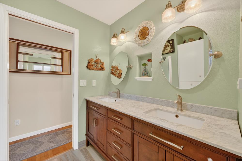 4831 Jan Drive Carmichael, CA 95608 - Photo 29 of 69 a bathroom with a double vanity sink and a mirror