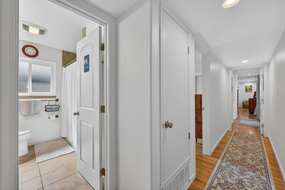 4831 Jan Drive Carmichael, CA 95608 - Photo 32 of 69 a view of a hallway with wooden floor and a bathroom