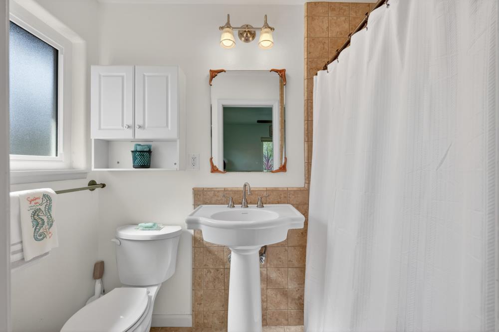 4831 Jan Drive Carmichael, CA 95608 - Photo 40 of 69 a bathroom with a sink toilet and mirror