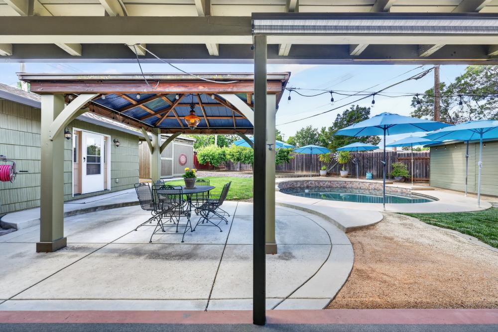 4831 Jan Drive Carmichael, CA 95608 - Photo 42 of 69 a patio with a table and chairs and a barbeque