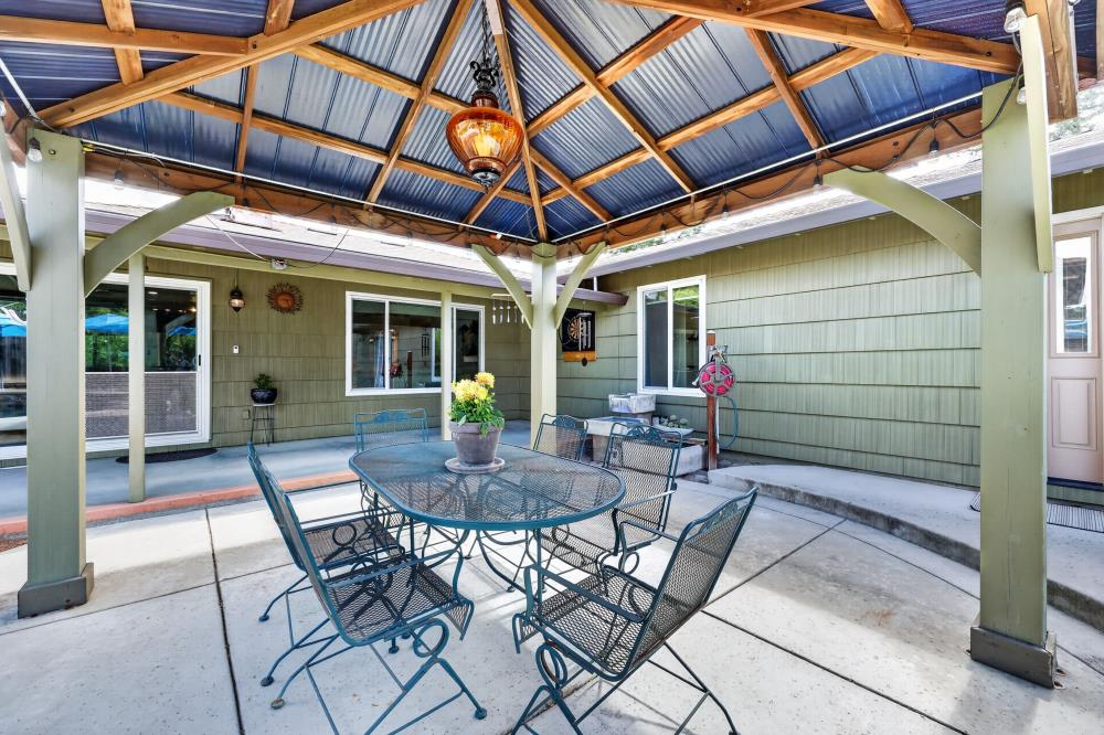 4831 Jan Drive Carmichael, CA 95608 - Photo 52 of 69 a view of a backyard with table and chairs and a barbeque