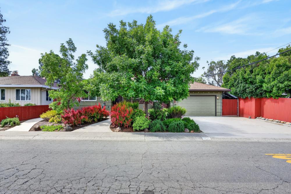 4831 Jan Drive Carmichael, CA 95608 - Photo 64 of 69 a front view of a house with a yard and potted plants