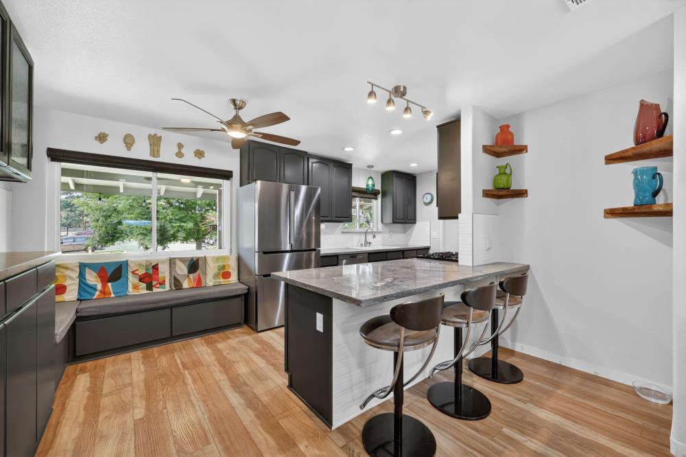 4831 Jan Drive Carmichael, CA 95608 - Photo 8 of 69 a kitchen with stainless steel appliances granite countertop a stove and a refrigerator