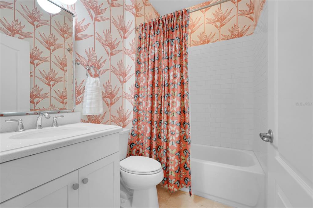 1038 Timbervale Trail Clermont, FL 34715 - Photo 16 of 54 a bathroom with a sink a toilet and a bathtub