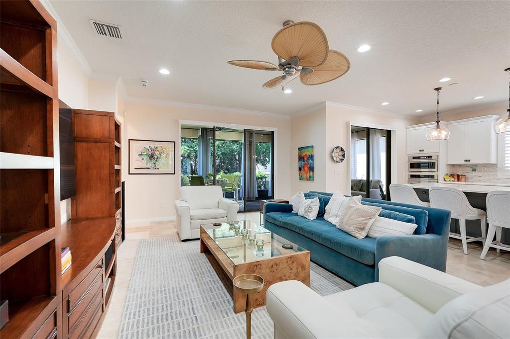 1038 Timbervale Trail Clermont, FL 34715 - Photo 17 of 54 a living room with furniture kitchen view and a large window