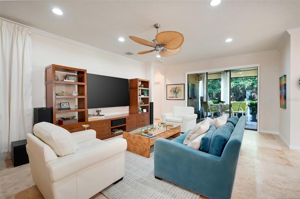 1038 Timbervale Trail Clermont, FL 34715 - Photo 19 of 54 a living room with furniture and a flat screen tv