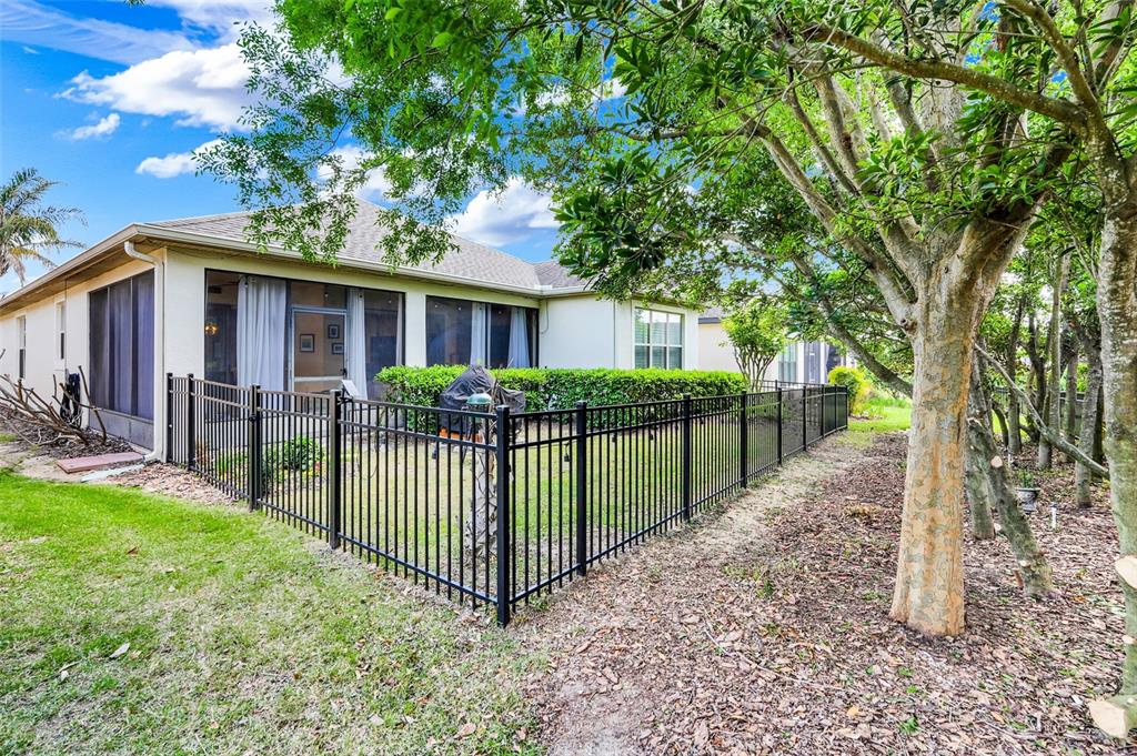 1038 Timbervale Trail Clermont, FL 34715 - Photo 38 of 54 a view of a house with a big yard plants and large trees