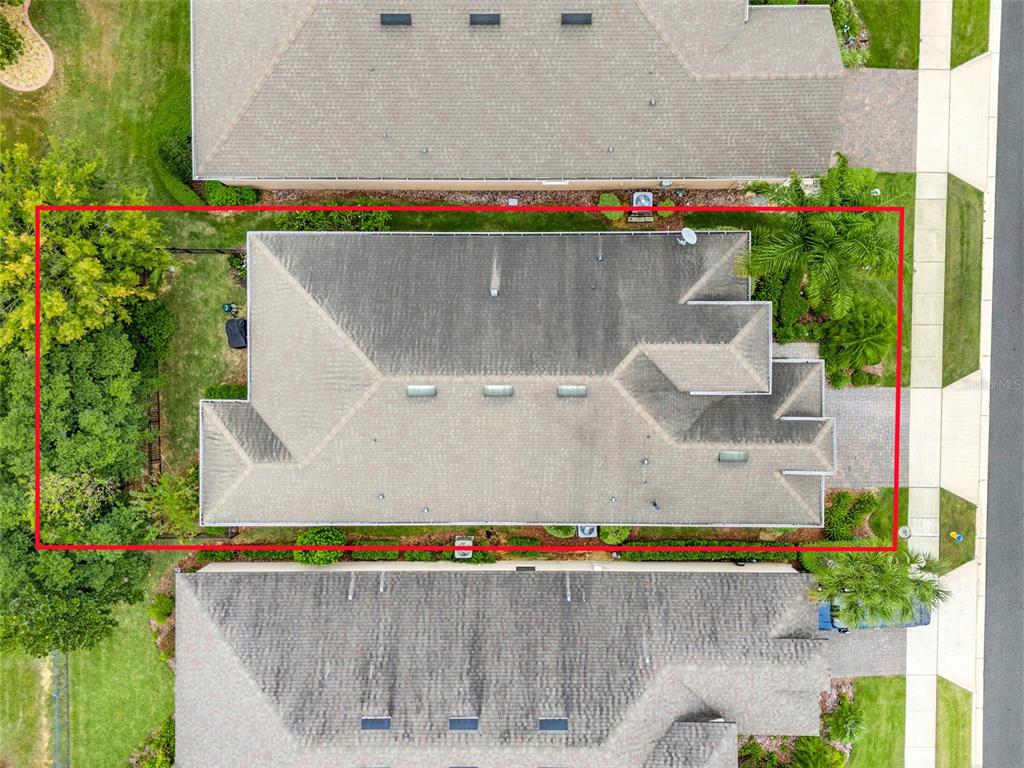 1038 Timbervale Trail Clermont, FL 34715 - Photo 43 of 54 an aerial view of a house with a yard and large trees