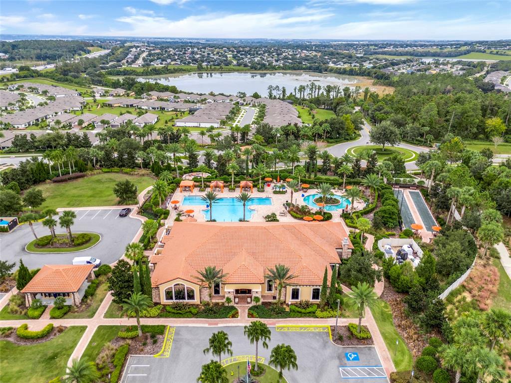 1038 Timbervale Trail Clermont, FL 34715 - Photo 52 of 54 an aerial view of residential houses with outdoor space and river