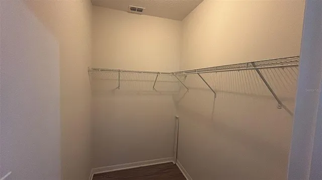 a bathroom with a sink a glass door shower and a mirror