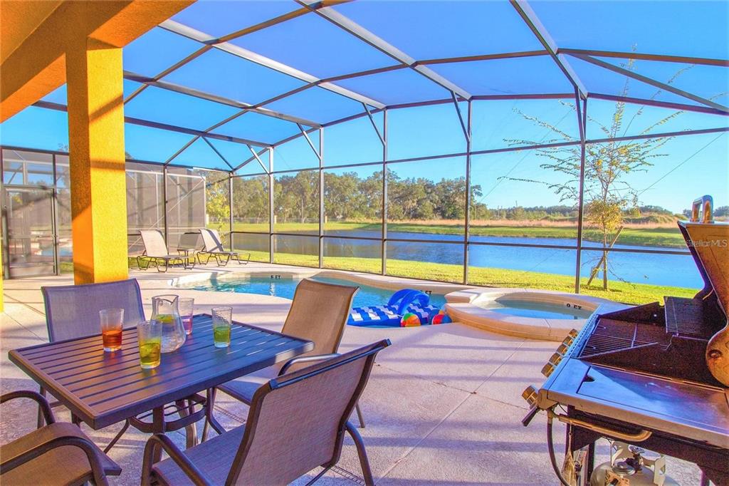 4445 Shiva Loop Kissimmee, FL 34746 - Photo 2 of 33 a view of an outdoor sitting area with furniture