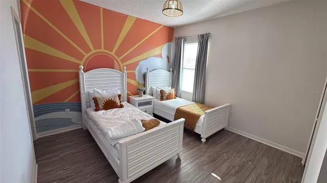 a white toilet sitting next to a bath tub