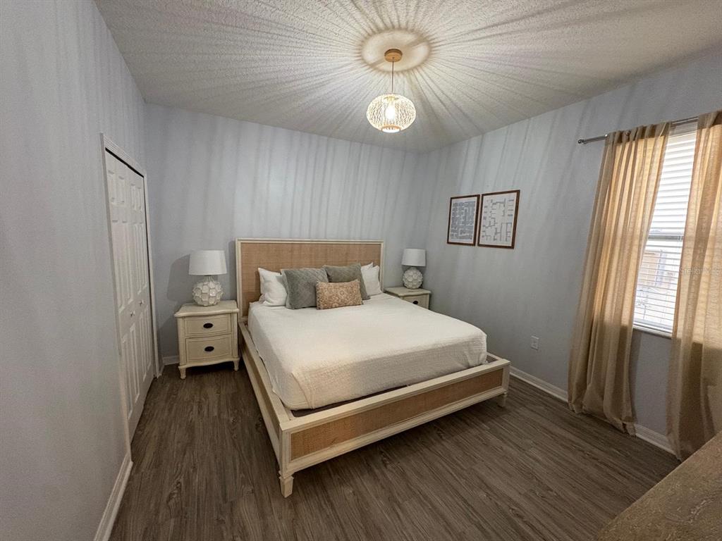 4445 Shiva Loop Kissimmee, FL 34746 - Photo 6 of 33 a bedroom with a bed and a window