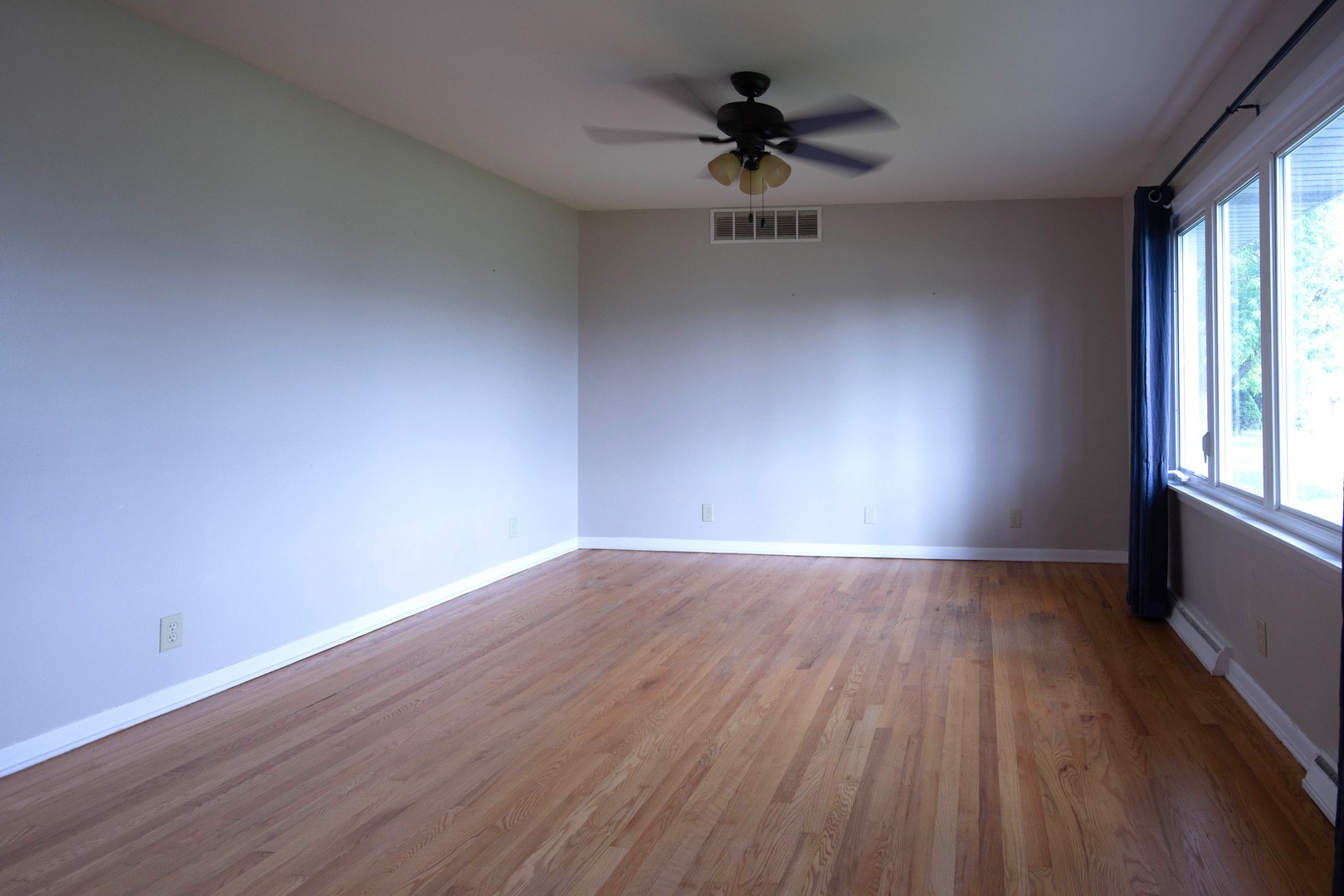 24116 South Frontage Road West Channahon, IL 60410 - Photo 3 of 15 a view of an empty room with wooden floor and a window