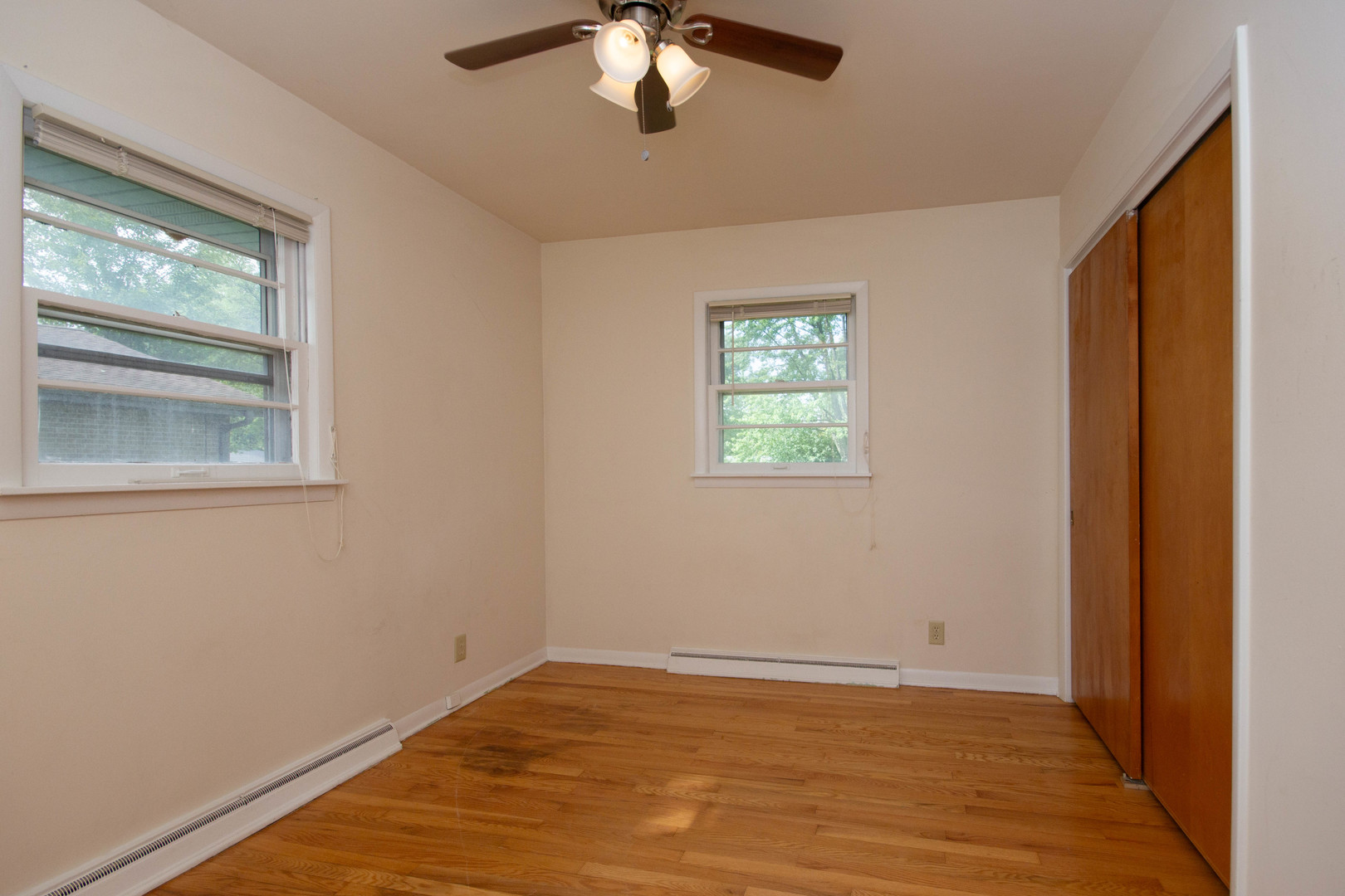 24116 South Frontage Road West Channahon, IL 60410 - Photo 9 of 15 a view of an empty room with wooden floor and a window