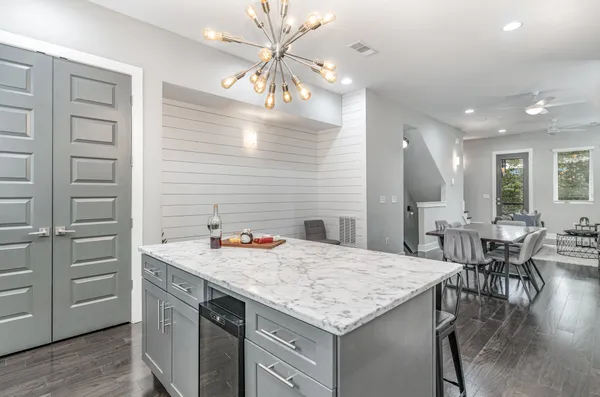 a kitchen with a table and chairs in it