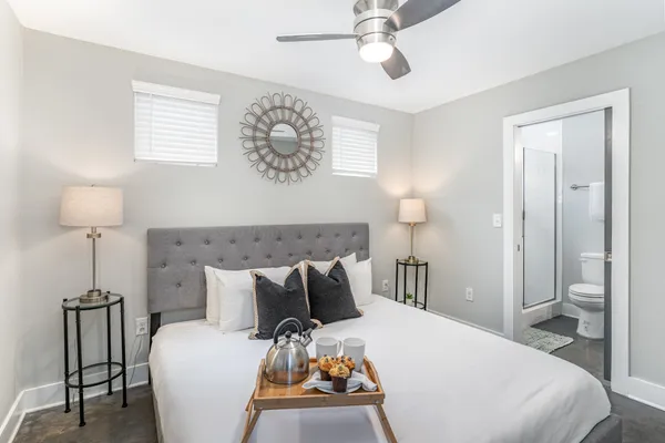 a bedroom with a bed and a table