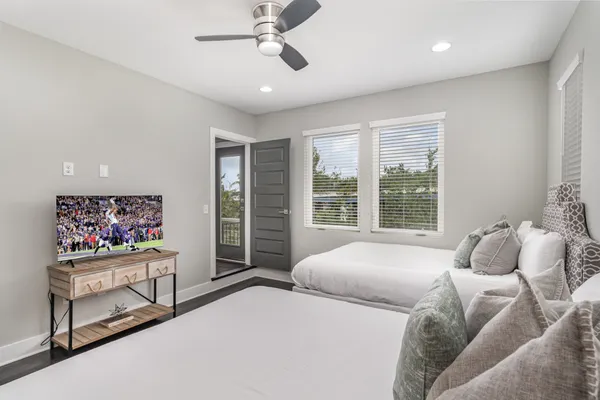 a bedroom with a bed and a flat screen tv