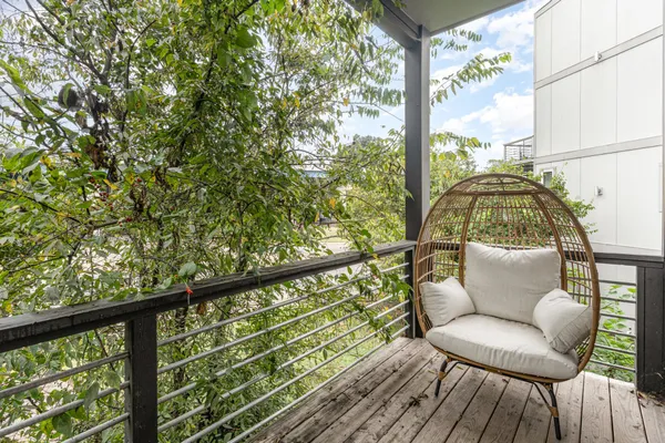 a view of workspace with wooden floor and windows