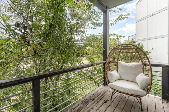a view of workspace with wooden floor and windows