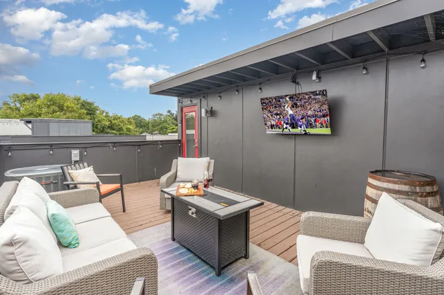 a outdoor living space with furniture and city view