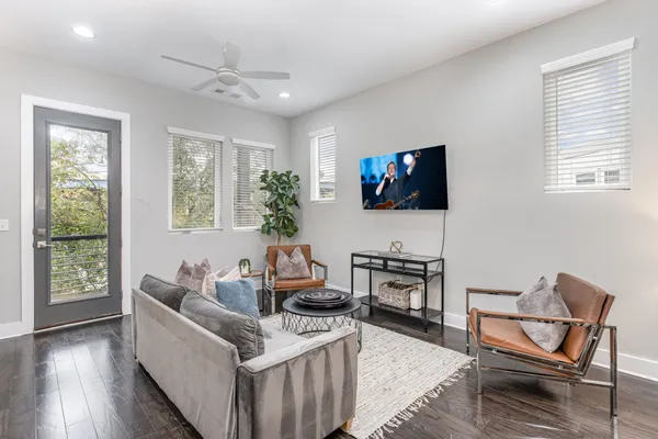a living room with furniture and a flat screen tv