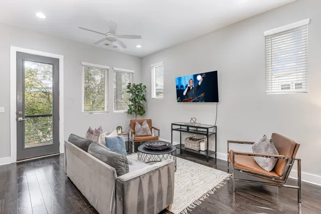 a living room with furniture and a flat screen tv