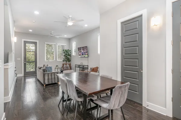 a view of a dining room with furniture and wooden floor