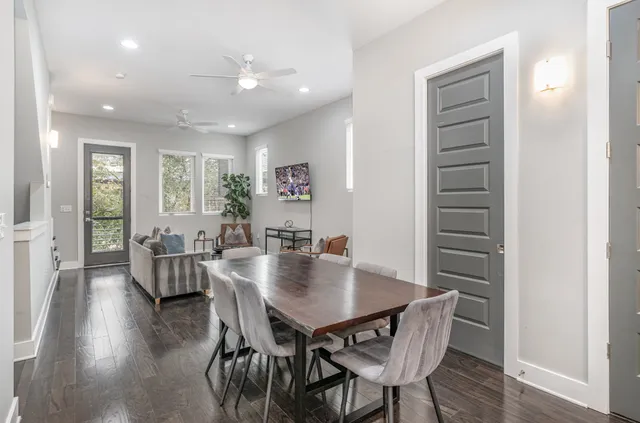 a view of a dining room with furniture and wooden floor
