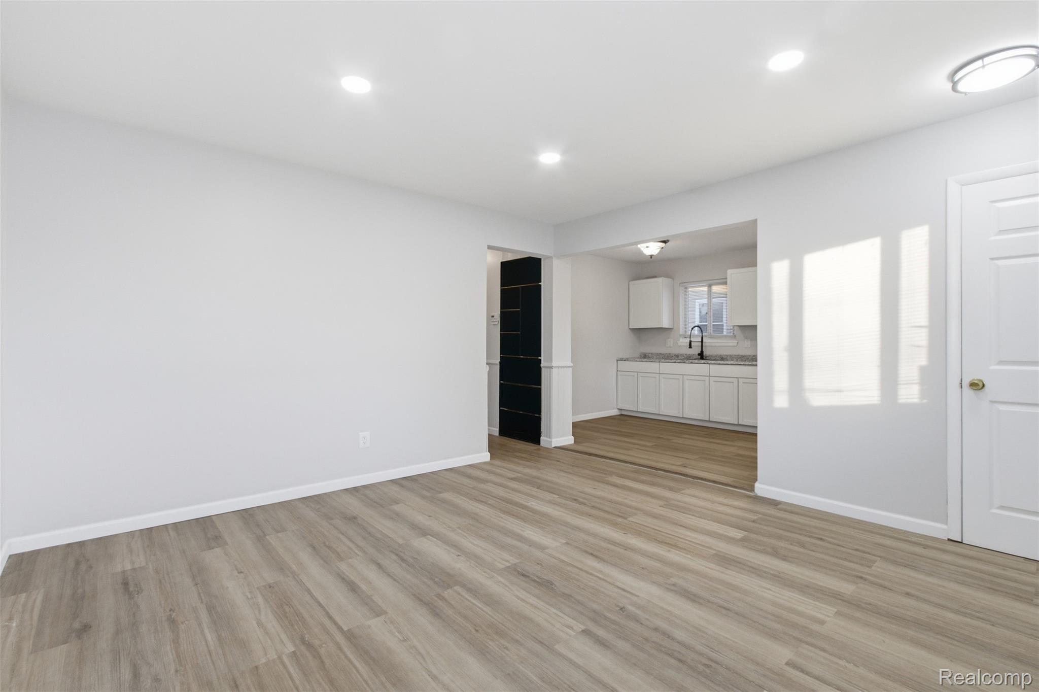 14731 Stephens Road Eastpointe, MI 48021 - Photo 7 of 15 Unfurnished living room featuring light wood-style flooring and recessed lighting