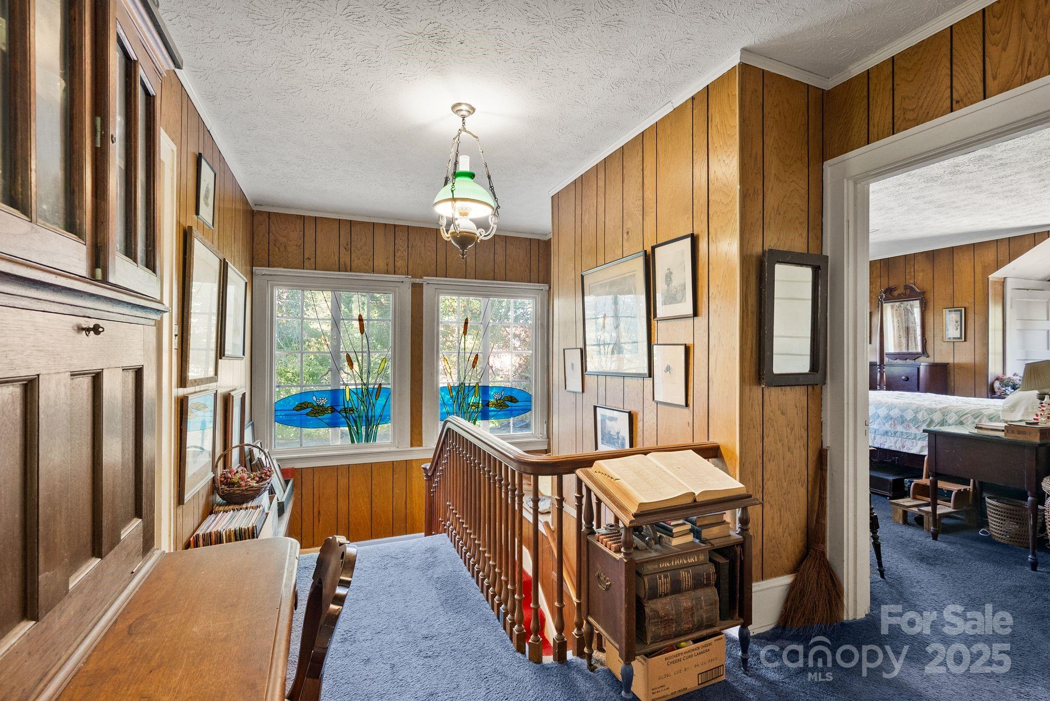 414 Beaucatcher Road Asheville, NC 28805 - Photo 14 of 34 a view of a livingroom with furniture wooden floor a chandelier