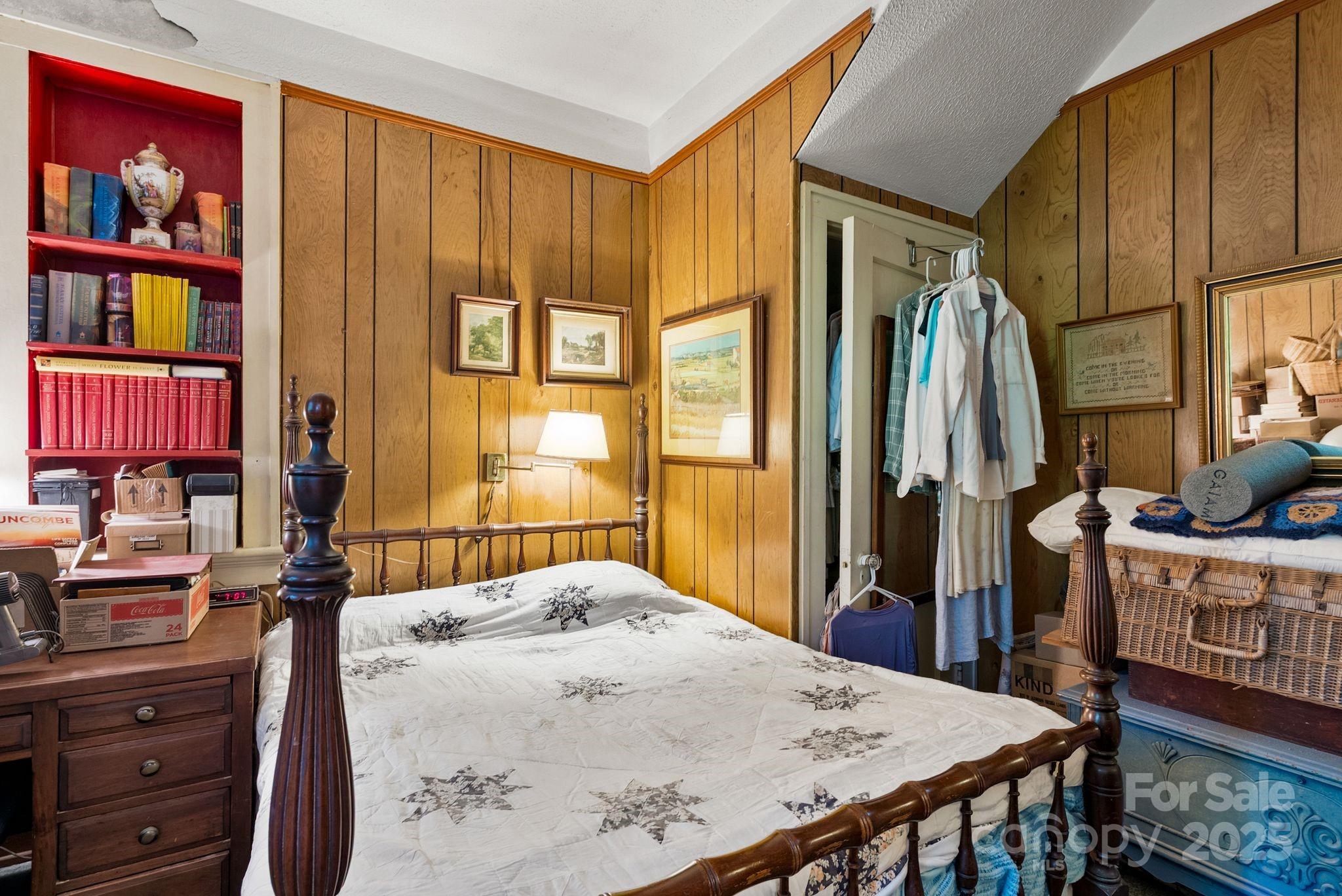 414 Beaucatcher Road Asheville, NC 28805 - Photo 21 of 34 a bed room with a bed and a dresser