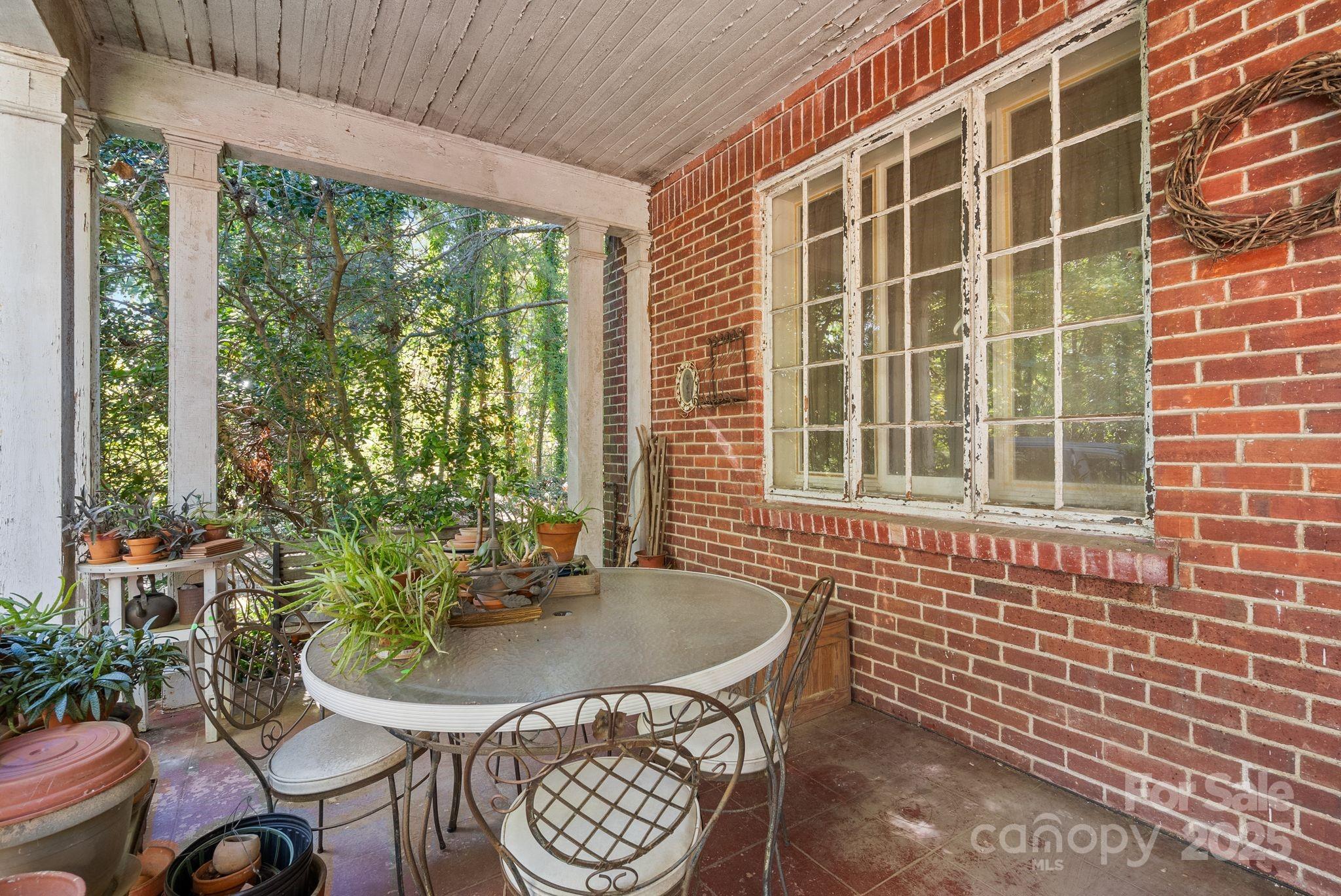 414 Beaucatcher Road Asheville, NC 28805 - Photo 24 of 34 a view of a balcony dining table and chairs