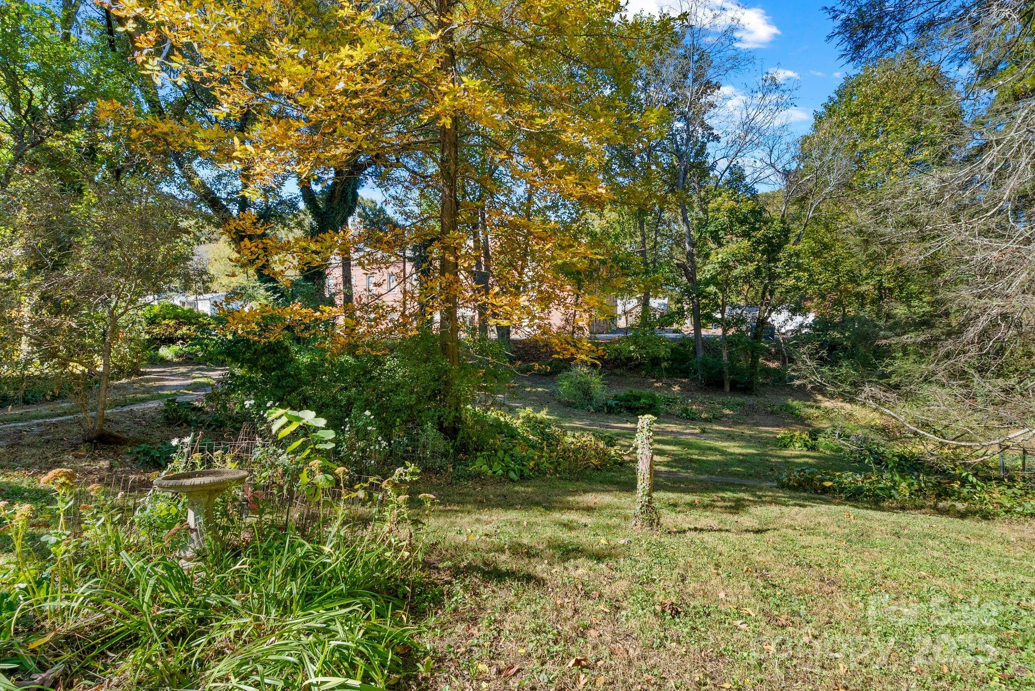 414 Beaucatcher Road Asheville, NC 28805 - Photo 32 of 34 a view of a bench in a garden