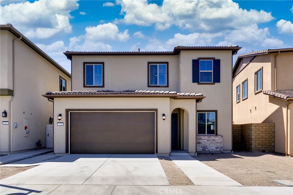 208 Lily Loop Irvine, CA 92618 - Photo 1 of 23 a front view of a house with yard