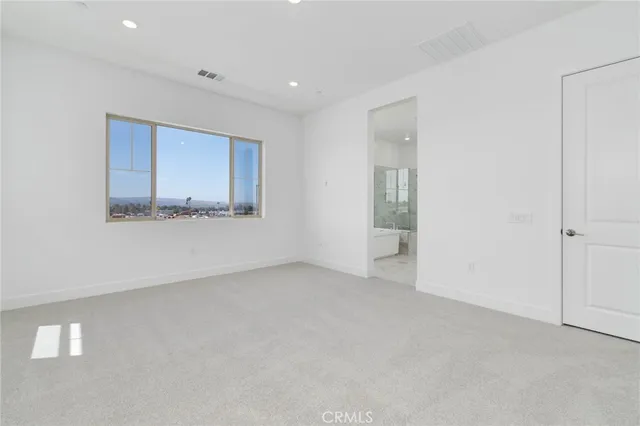 an empty room with a bathroom