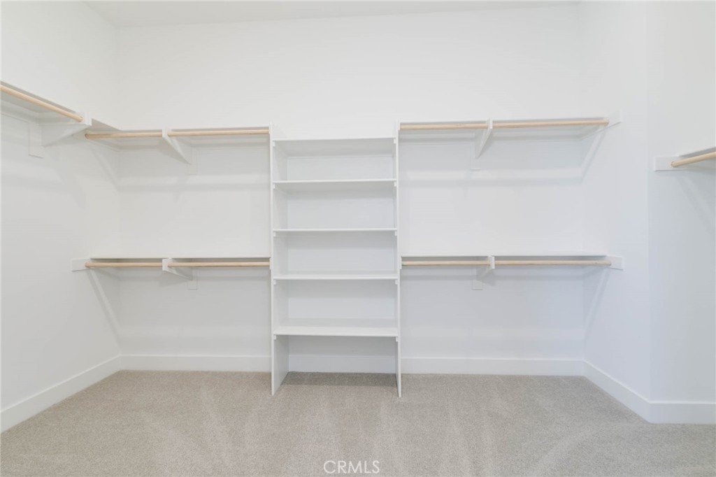 208 Lily Loop Irvine, CA 92618 - Photo 14 of 23 a view of an empty walk in closet