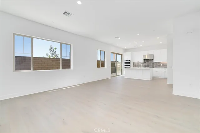 a view of a kitchen with a sink and cabinets