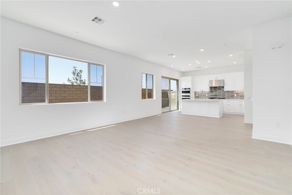 208 Lily Loop Irvine, CA 92618 - Photo 2 of 23 a view of a kitchen with a sink and cabinets