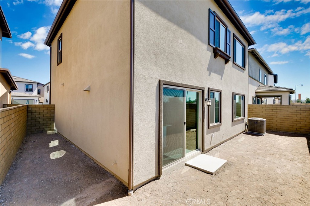 208 Lily Loop Irvine, CA 92618 - Photo 21 of 23 a view of a house with backyard and sitting area
