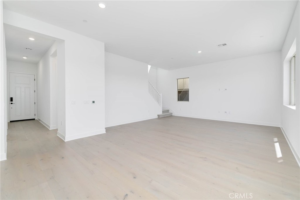 208 Lily Loop Irvine, CA 92618 - Photo 5 of 23 an empty room with closet and windows