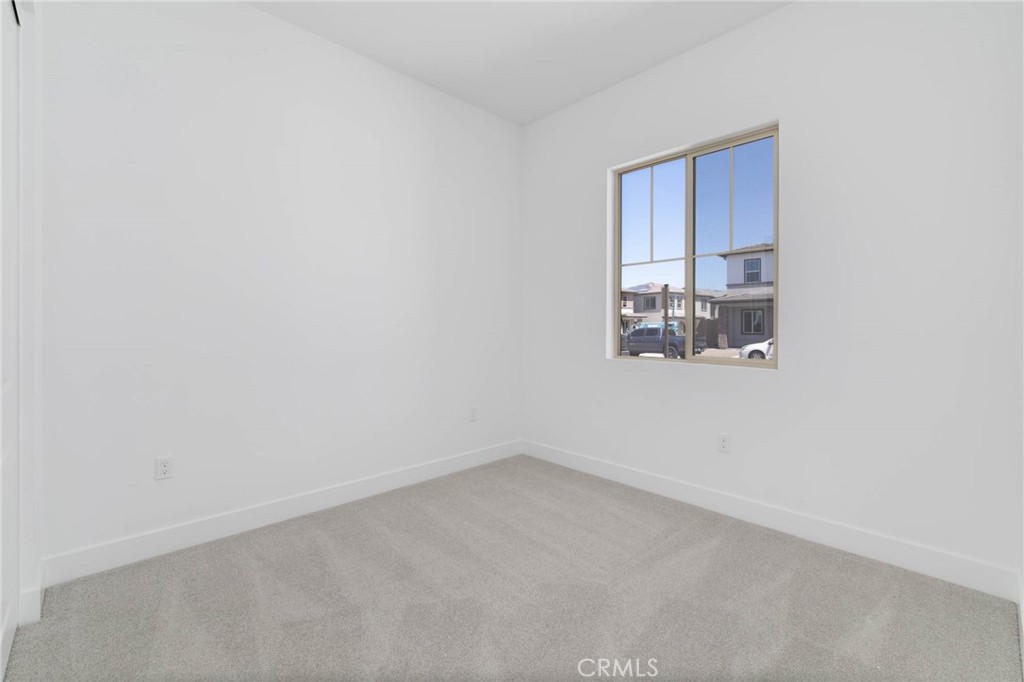 208 Lily Loop Irvine, CA 92618 - Photo 7 of 23 a view of a room with window