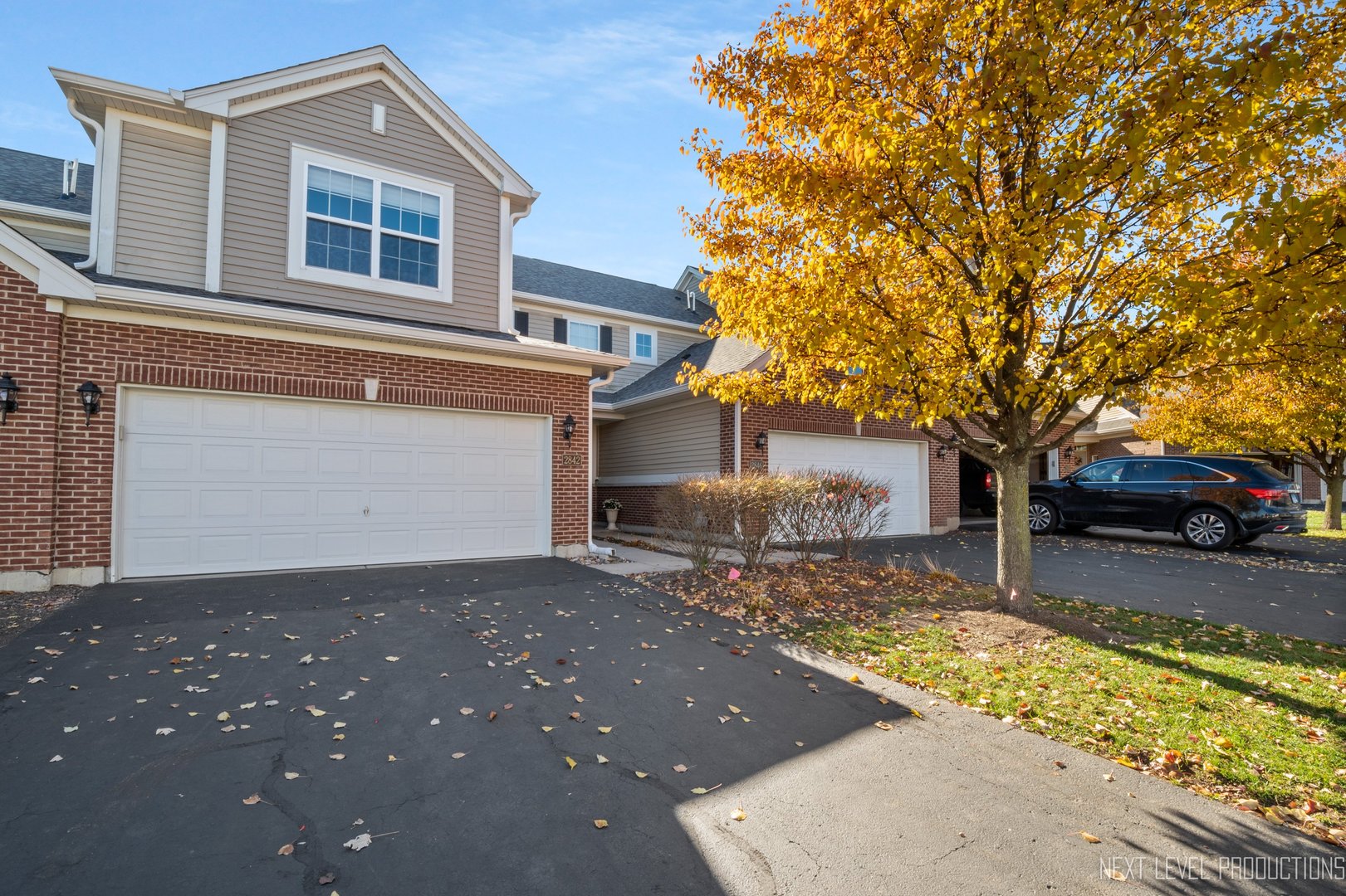 2842 Church Road Aurora, IL 60502 - Photo 27 of 28 a front view of a house with a yard and garage