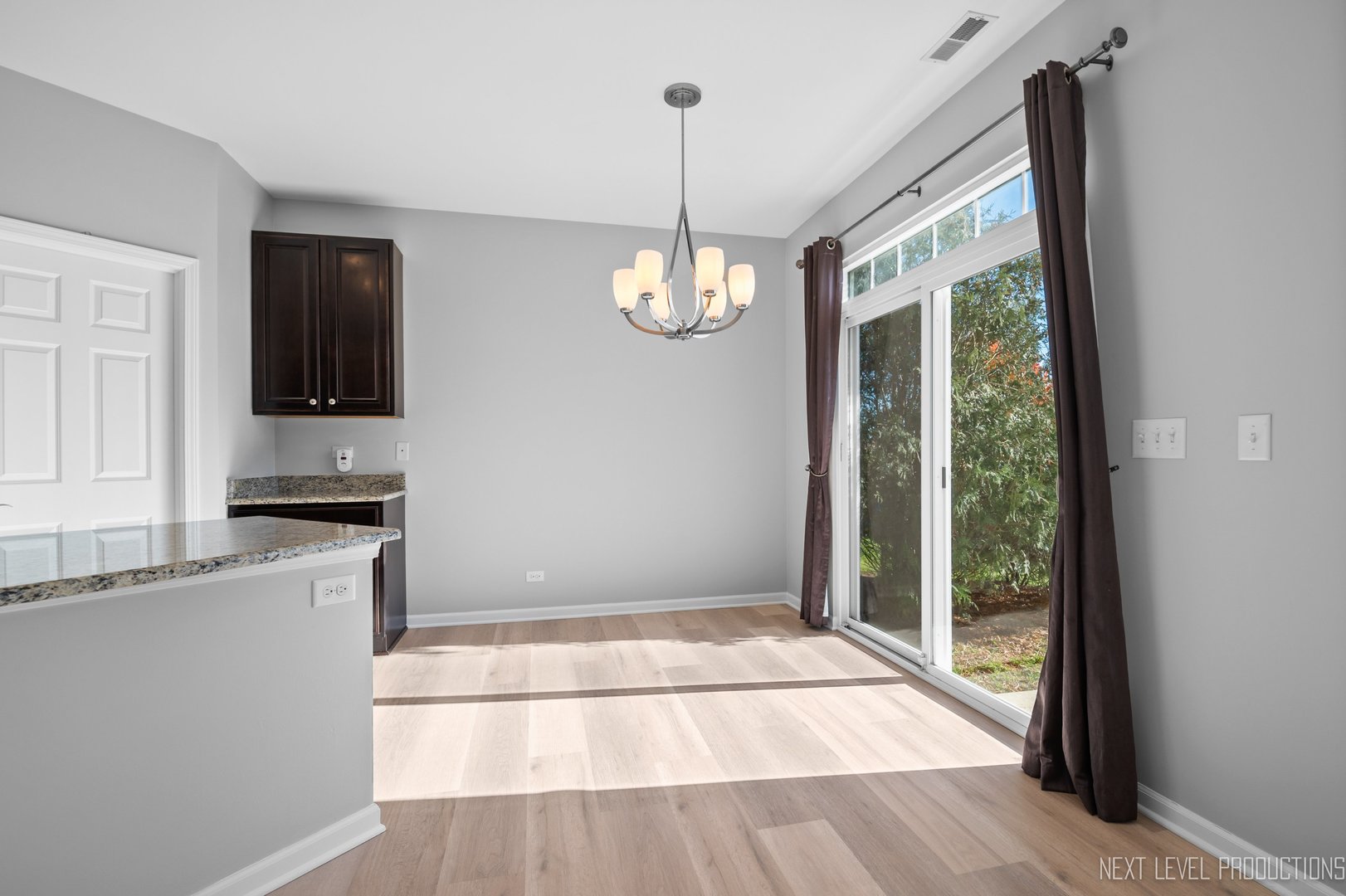2842 Church Road Aurora, IL 60502 - Photo 10 of 28 a view of a kitchen with a sink wooden floor and a window