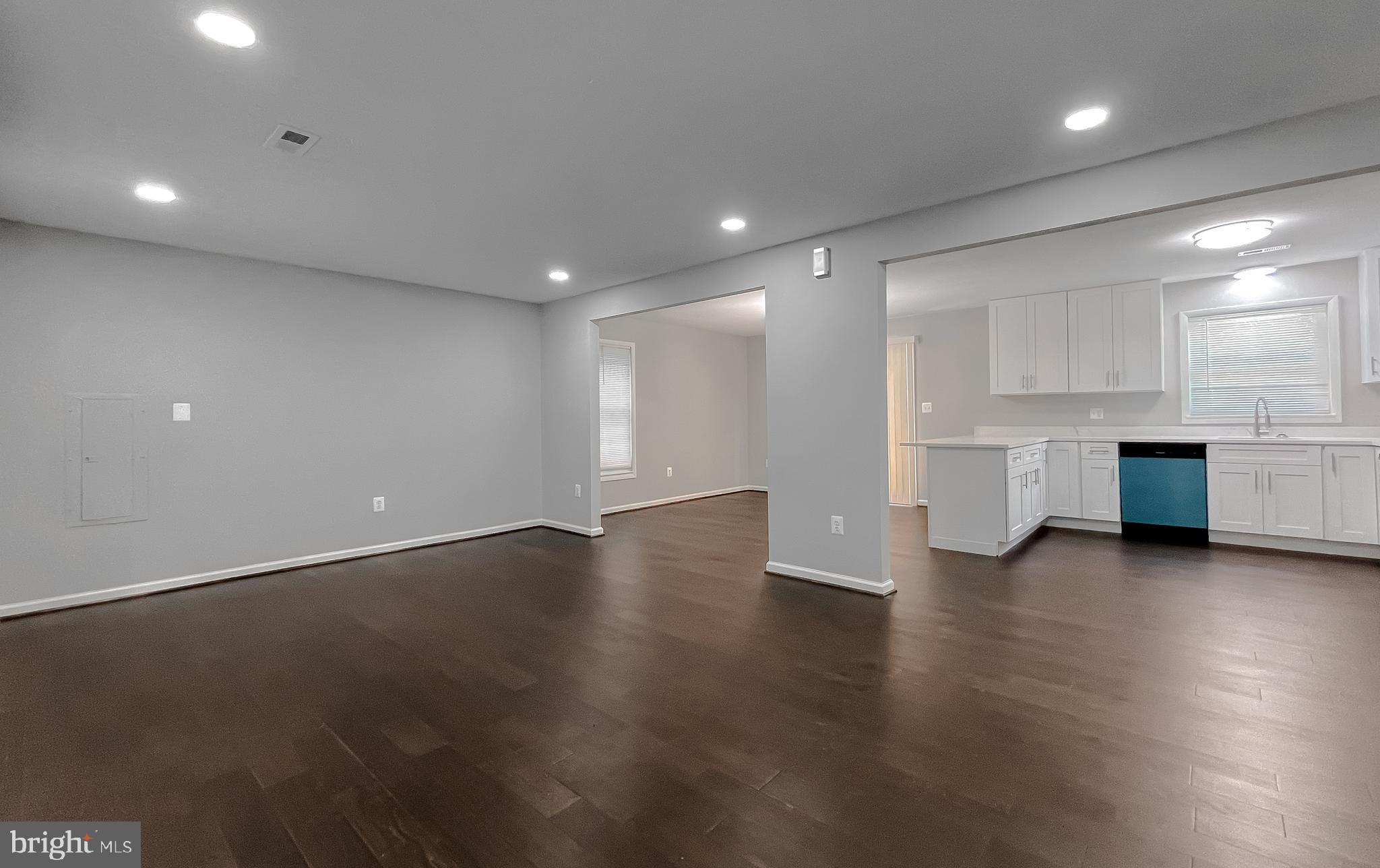 29810 Washington Road Mechanicsville, MD 20659 - Photo 16 of 44 an empty room with wooden floor and windows