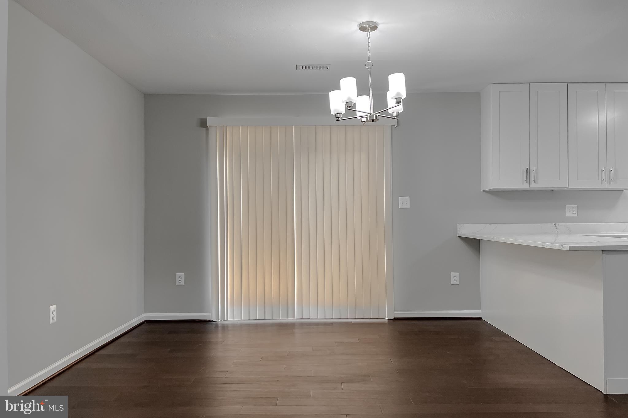 29810 Washington Road Mechanicsville, MD 20659 - Photo 26 of 44 an empty room with wooden floor and window